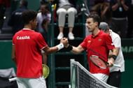 Felix Auger Aliassime (L) and Roberto Bautista Agut at the 2019 Davis Cup